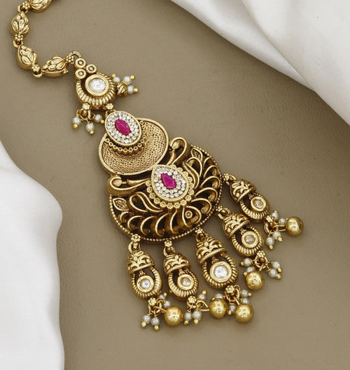 Antique Gold-Plated Maang Tikka with Pink Stones and Pearl Droplets