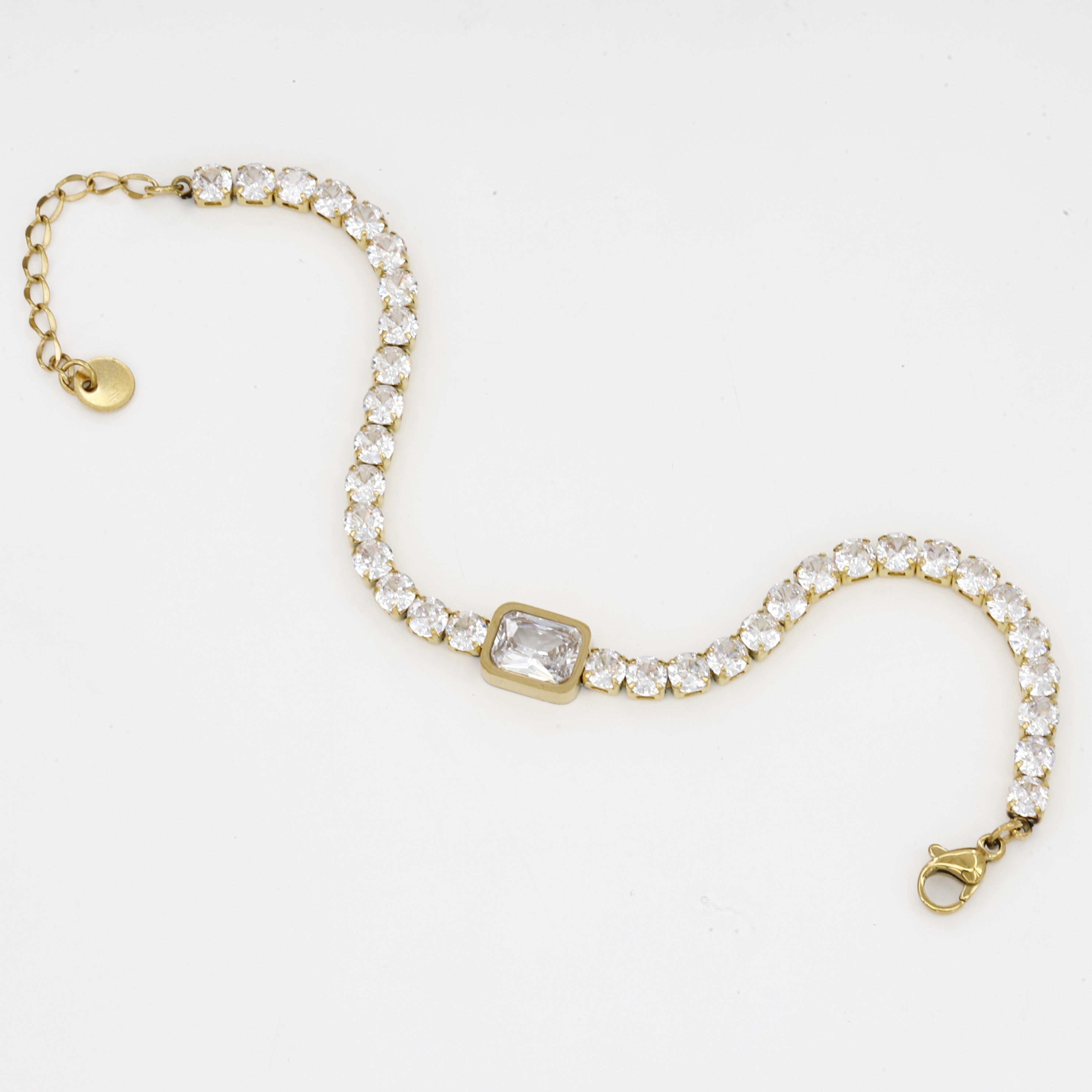 Gold Tennis Bracelet with Emerald Cut Center Stone
