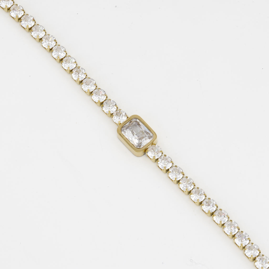 Gold Tennis Bracelet with Emerald Cut Center Stone