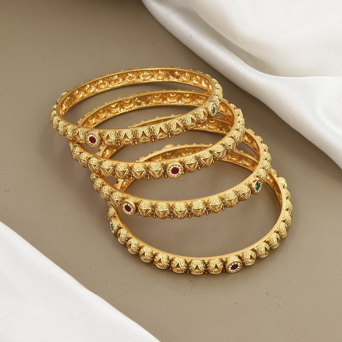 Intricate Gold-Plated Designer Bangles with Gemstones