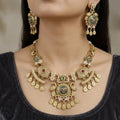 Gold Toned Peacock & Floral Motif Necklace Set with Ruby & Green Stones